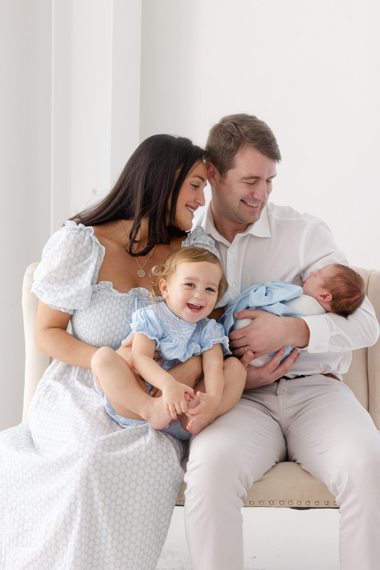All giggles with big sister for a sweet family photo